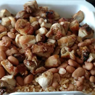 Large portion to go - Bourbon chicken and two chosen sides (spicy rice and beans)