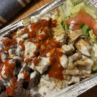 Beef Shwarma and chicken Shwarma mix over rice