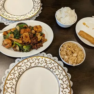 Triple delight, fried rice, steamed rice, and 1 spring roll.