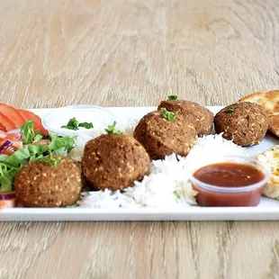 a plate of food on a wooden table