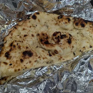 Garlic Naan, chewy texture with garlic pieces but not very buttery/salty.
