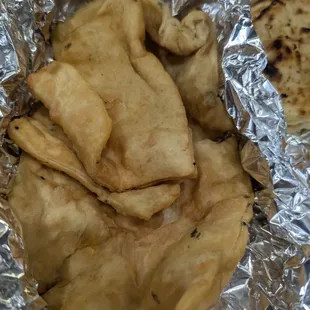 Bhatura, would probably be better fresh but this is a take out restaurant so the quality suffers.