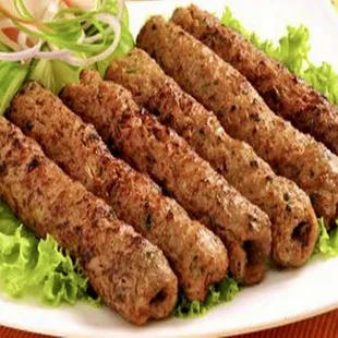 a plate of halal kebab and wings