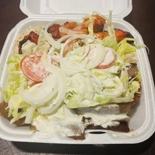 8. Gyro with Chicken Kebab full of sauce for the order of no sauce.