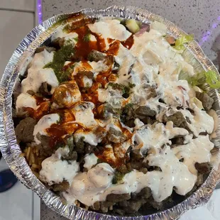 Da platter w yellow rice and chicken and lamb and salad and flatbread...