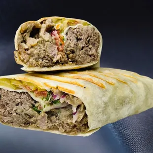 Beef Shawarma Wrap.
Hand sliced premium Halal beef, marinated with our special shawarma spices. fresh lettuce, tomato, onion, pickles.....