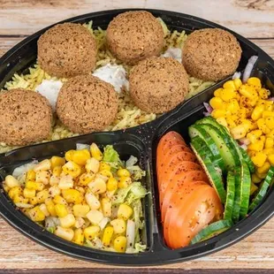 Vegan Falafel Platter.
Choice of Over Rice or Over Hummus with choice of 5 sides