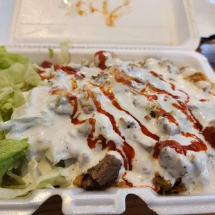 Chicken and gyro rice dish. Too much white sauce