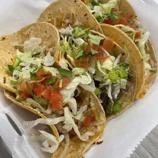 Shrimp taco, steak taco, fish taco on corn tortillas