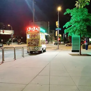 a food truck parked on the side of the road