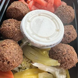 a variety of vegetables in a plastic container