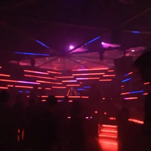 a crowd of people dancing at a nightclub