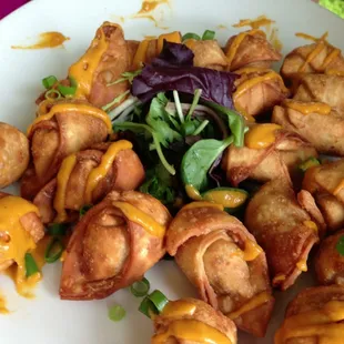 Kalua pig and goat cheese won ton w/ roasted pepper purée.