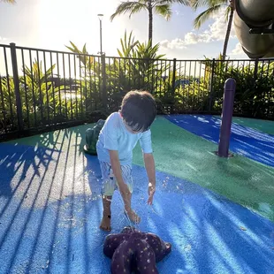 Infant and toddler gated splash pad area