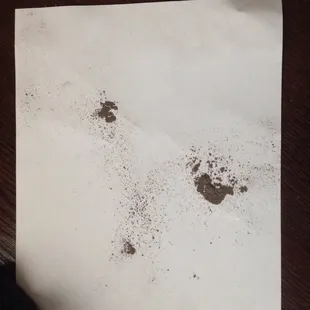 A SMALL portion of dust from the drilled holes for mounting the individual pieces.