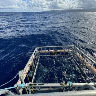 The cage beside the boat.