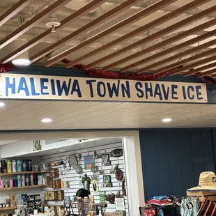 The store front looks like a gift shop, but in the back is a line of people waiting for their order!