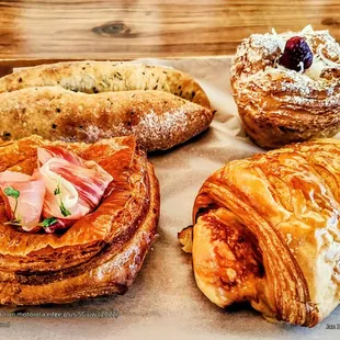 Prosciutto Danish, Ham &amp; Cheese Croissant. (front L-R) Caraway Seed Sesame Bread, Coconut Danish. (back L-R) Halekulani Bakery.