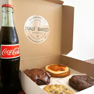 a box of cookies and a bottle of coke