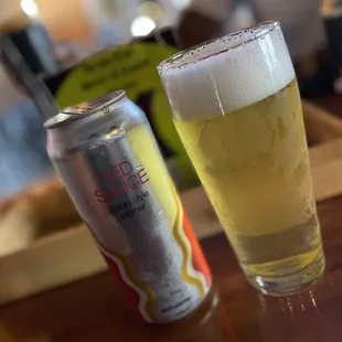 a half - full beer and a half - empty can