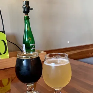 a glass of beer and a half barrel beer