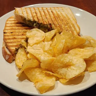 Chicken pesto panini sandwich plate.