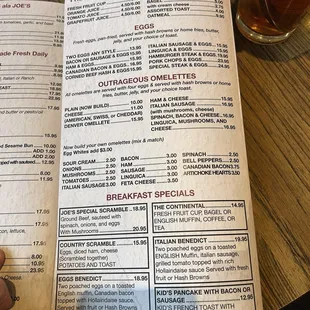 Menu: Breakfast variety including fresh fruit, eggs, omelettes, cereal, and breakfast specials available until 3 PM. May 2024
