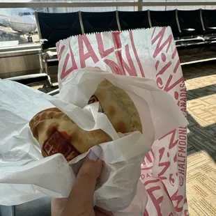 Bacon, egg, and cheese empanada and Dulce de leche empanada