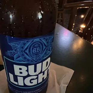 a bottle of beer on a napkin