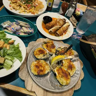 Bienville oysters, Caesar salad, sautéed egg rolls on the appetizer menu, chicken nachos
