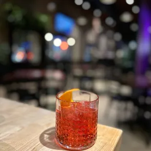 a drink in a glass on a table