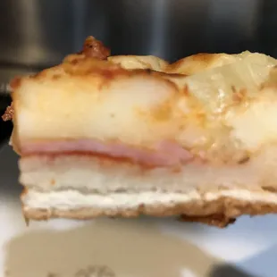 Next day cross section of the Hawaiian pizza.  Yeah, THAT, is a layer of cheese!