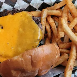 Cheeseburger and fries.  It is a smashed burger
