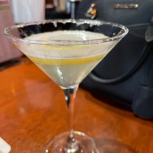 a martini with a lemon slice in it