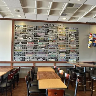 a wall full of beer bottles