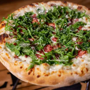 BLT-Bourbon Bacon, Heirloom Tomatoes, Arugula tossed in citrus dressing.