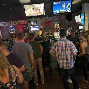 a large group of people at a bar