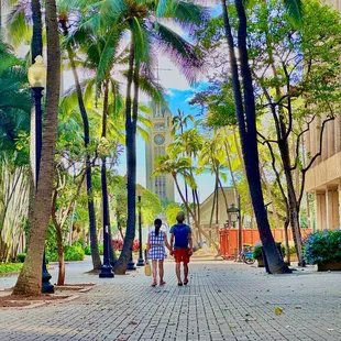 Couple walking through Downtown Honolulu on the island of Oahu, Hawaii.