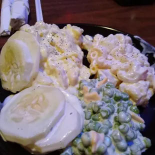 Homemade salads including macaroni salad, potato salad, pea salad and creamy cucumbers