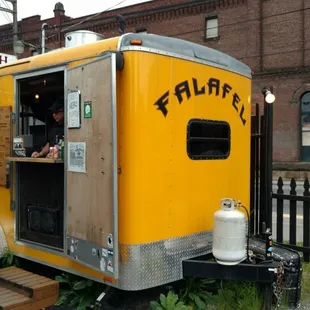 a woman ordering food from a food truck