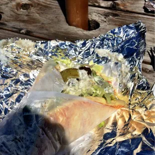 a sandwich wrapped in foil