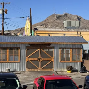 two cars parked in front of a building
