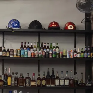 a shelf full of alcohol bottles