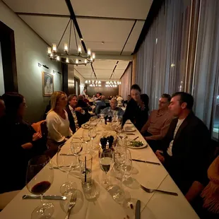 people sitting at a long table