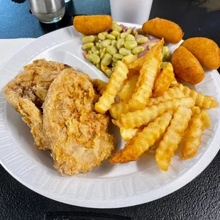 Fried pork chops, butter beans, fries and hush puppies. Fantastic! The place is very clean.