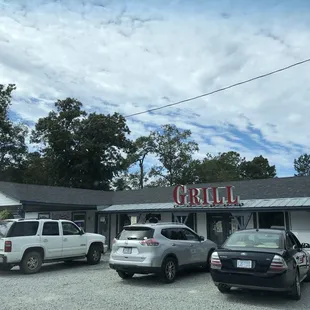 cars parked in front of the restaurant