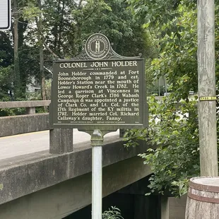 Out front beside parking area