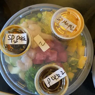 Build your own poke bowl to-go. Sauces on the side AND numbered for each order.
