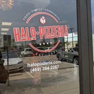 the reflection of a woman in the window