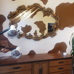 Love the large vintage mirror upon entrance